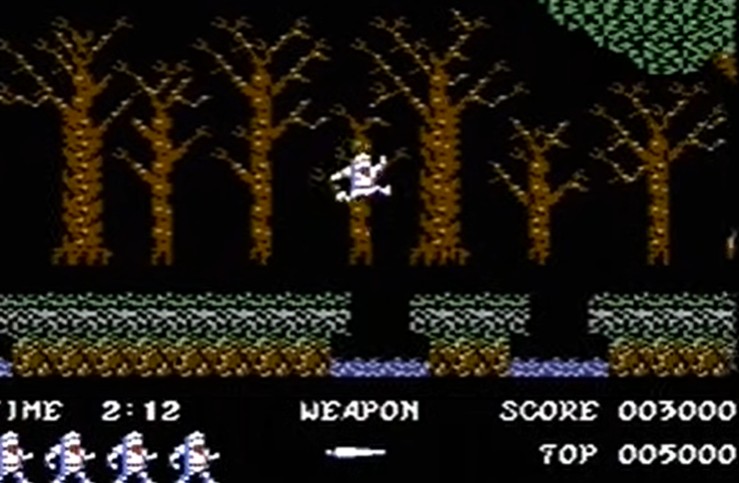 Ghosts N Goblins C64 - Arthur saltando en bosque entre plataformas score 003000
